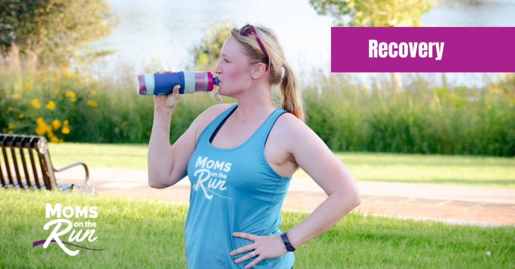 woman drinking water after exercise