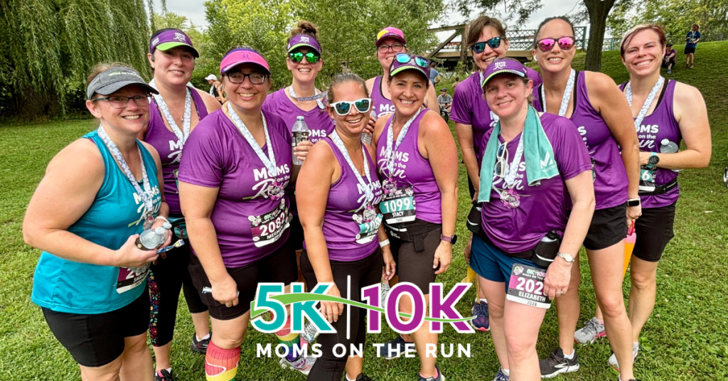 women in purple shirts after a race